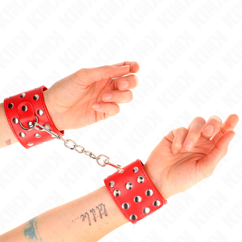 KINK - WRIST RESTRAINTS WITH PUSH CLOSURE, FULL OF RIVETS, RED, ADJUSTABLE 19-24 CM X 5.5 CM